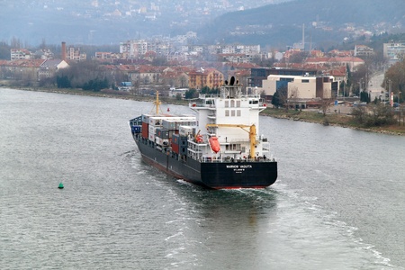VARNA, BULGARIA - DECEMBER 14: Cargo ship WARNOW VAQUITA (Year Built: 2008) sails into open sea on December 14, 2010 in Varna, Bulgaria. Ship`s next destination is Constanta, Romania.のeditorial素材