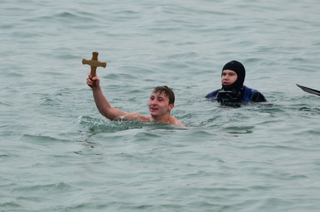 VARNA, BULGARIA - JANUARY 6: Anzhel Dimitrov recovered the cross for a forth successive year. Bulgarian Eastern Orthodox Church honors Epiphany on January 6, 2011 in Varna, Bulgaria のeditorial素材