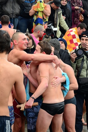 VARNA, BULGARIA - JANUARY 6: Anzhel Dimitrov recovered the cross for a forth successive year. Bulgarian Eastern Orthodox Church honors Epiphany on January 6, 2011 in Varna, Bulgaria のeditorial素材
