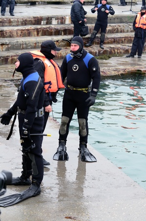 VARNA, BULGARIA - JANUARY 6: Eastern Orthodox Church honors Epiphany on January 6, 2011 in Varna, Bulgaria. Lieutenant Boyan Dobrev's Diving command was on duty to ensure the safety of the event. のeditorial素材