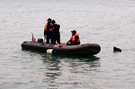 VARNA, BULGARIA - JANUARY 6: Eastern Orthodox Church honors Epiphany on January 6, 2011 in Varna, Bulgaria. Lieutenant Boyan Dobrev's Diving command was on duty to ensure the safety of the event. のeditorial素材