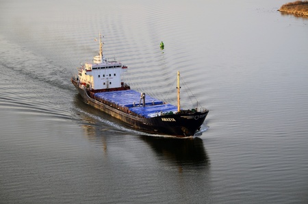 VARNA, BULGARIA - JANUARY 26: Cargo ship AMASYA (Flag: St Kitts Nevis, Year Built: 1974) sails into...