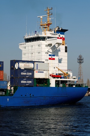 VARNA, BULGARIA - MARCH 14: Cargo ship HOLANDIA (Flag: Antigua Barbuda, Year Built: 2000) sails into Port of Varna-West to be loaded with containers on March 14, 2011 in Varna, Bulgaria. のeditorial素材