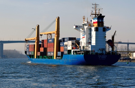 VARNA, BULGARIA - MARCH 14: Cargo ship HOLANDIA (Flag: Antigua Barbuda, Year Built: 2000) sails into Port of Varna-West to be loaded with containers on March 14, 2011 in Varna, Bulgaria. のeditorial素材