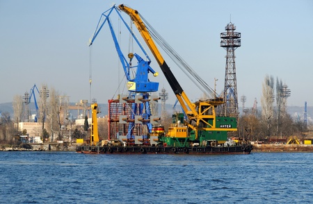VARNA, BULGARIA - MARCH 14: 100 tons floating crane "Antey" (IMO: 9022116) on duty. The unique vessel is sailing towards Port of Varna-East on March 14, 2011 in Varna, Bulgaria. のeditorial素材