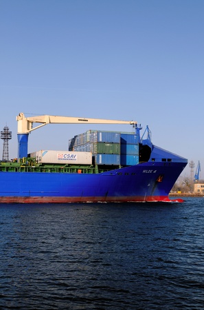 VARNA, BULGARIA, MARCH 14: Turkish cargo ship HILDE A (Year Built: 2005, Dead Weight: 22033 t) is sailing away into open sea after a short stay in Varna-west port on March 14, 2014 in Varna, Bulgariaのeditorial素材