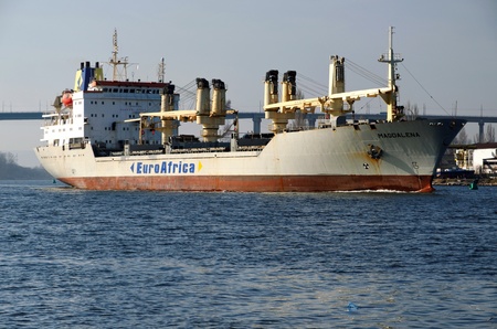 VARNA, BULGARIA - MARCH 14: Cargo ship MAGDALENA (Year Built: 1988, Dead Weight: 13864 t) is sailing away into open sea after a short stay in Varna-west port on March 14, 2011 in Varna, Bulgariaのeditorial素材