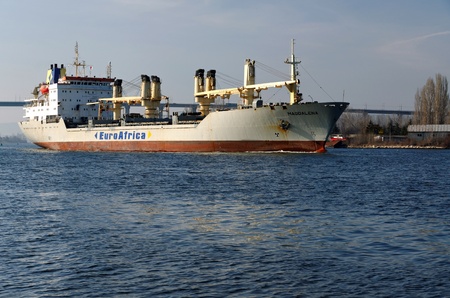 VARNA, BULGARIA - MARCH 14: Cargo ship MAGDALENA (Year Built: 1988, Dead Weight: 13864 t) is sailing away into open sea after a short stay in Varna-west port on March 14, 2011 in Varna, Bulgariaのeditorial素材