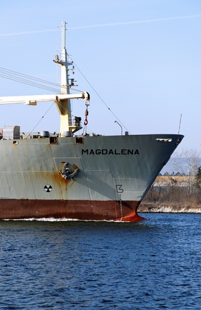 VARNA, BULGARIA - MARCH 14: Cargo ship MAGDALENA (Year Built: 1988, Dead Weight: 13864 t) is sailing away into open sea after a short stay in Varna-west port on March 14, 2011 in Varna, Bulgariaのeditorial素材