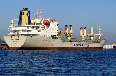 VARNA, BULGARIA - MARCH 14: Cargo ship MAGDALENA (Year Built: 1988, Dead Weight: 13864 t) is sailing away into open sea after a short stay in Varna-west port on March 14, 2011 in Varna, Bulgariaのeditorial素材