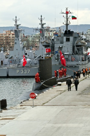 VARNA, BULGARIA - APR 08: Crew members stand on board the Turkish submarine DOLUNAY (S-352) on April 08, 2011 in Varna, Bulgaria. The vessel is taking part in Starfish 2011 Naval exercise.のeditorial素材