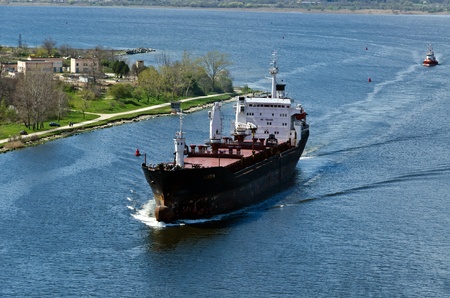 VARNA, BULGARIA - APR 22: Cargo ship LINDEN (Year Built: 1977, Flag: Moldova) sails away into open sea after a short stay in Varna-west port on April 22, 2011 in Varna, Bulgaria.のeditorial素材