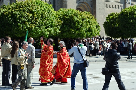 VARNA, BULGARIA - MAY 6: Unidentified priest is blessing the flags of the participants in a military parade on May 6, 2011 in Varna, Bulgaria. May 6, is the Day of the Bulgarian Army. のeditorial素材