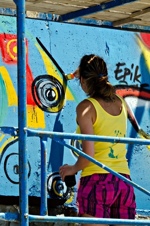 VARNA, BULGARIA - JUNE 2: Graffiti artist on a scaffolding at the "Creatures from Black Sea" Sprite Graffiti Jam 2011 in Port of Varna, on June 2, 2011 in Varna, Bulgaria. のeditorial素材