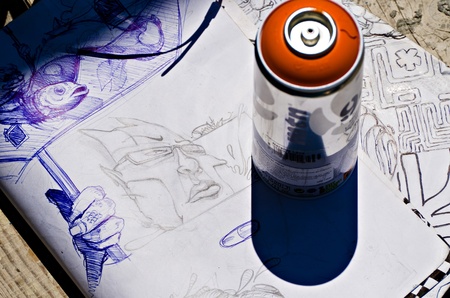 VARNA, BULGARIA - JUNE 2: Color spray can and a sketch used by graffiti artist at the "Creatures from Black Sea" Sprite Graffiti Jam in Port of Varna, on June 2, 2011 in Varna, Bulgaria. のeditorial素材