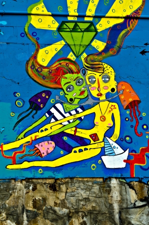 VARNA, BULGARIA - JUNE 5: Part of the eighty meters long graffiti painted on the breackwater wall at Port of Varna as part of the "Creatures from Black Sea" Sprite Graffiti Jam 2011 on June 5, 2011 in Varna, Bulgaria.のeditorial素材