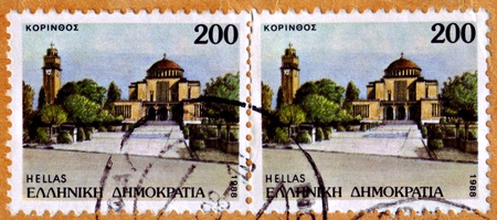 GREECE - CIRCA 1988: Two identical 200d stamps from Greece a show image of a clock tower and a Byzantine Basilica in Korinos, Paralia, Pierias, Greece, circa 1988.のeditorial素材