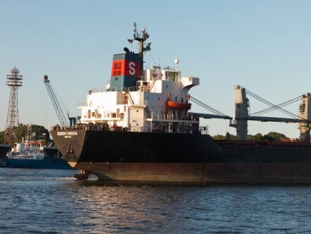 VARNA, BULGARIA - JULY 21: Bulk carrier SIDER FAIOCH, Flag: Italy, Year Built: 1986, sails into open sea on July 21, 2012 in Varna, Bulgaria. Ship`s next destination is Taman, Russia.のeditorial素材