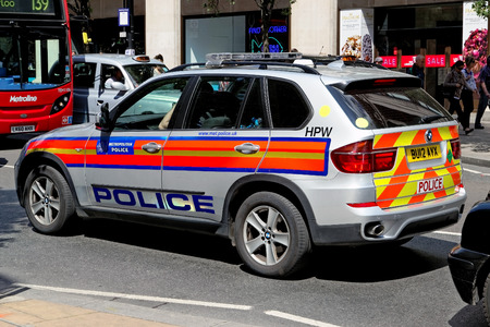 LONDON - JULY 1: London Metropolitan Police BMW car on July 1, 2014 in London. The Met was formed in 1829 and as of 2011 employed 48,661 staff making it one of biggest employers in London.のeditorial素材