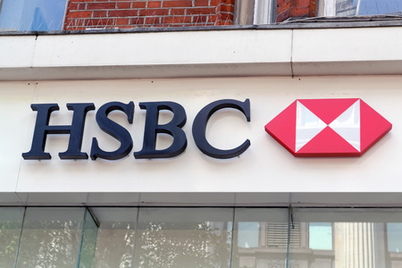 LONDON - JULY 1, 2014: The sign of HSBC bank on Oxford Street in London. Founded in 1865, HSBC is currently the world\'s second largest bank company.のeditorial素材