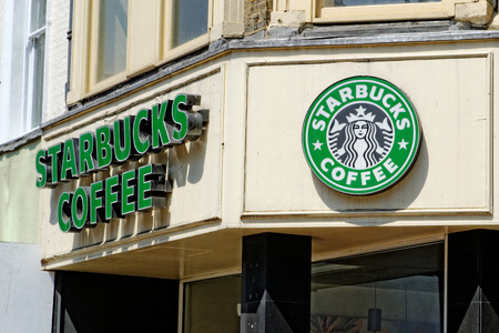 London, England - July 1, 2014: Exterior of a Starbucks coffee shop in London, England. Starbucks is the largest coffeehouse company in the world, with stores in 62 countries.のeditorial素材