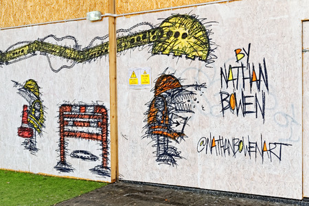 LONDON - JULY 1, 2014. New street art piece in Tottenham Court Road,Centre Point made by Nathan Bowen - a creative street artist from London.のeditorial素材