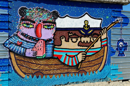 Varna, BULGARIA - December 14, 2014: Street art by unknown artist of a captain holding a fishing rod close to Port of Varna.のeditorial素材