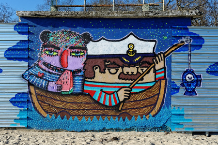 Varna, BULGARIA - December 14, 2014: Street art by unknown artist of a captain holding a fishing rod close to Port of Varna.のeditorial素材
