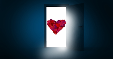 Red heart shape on white paper against blue backgroundの写真素材