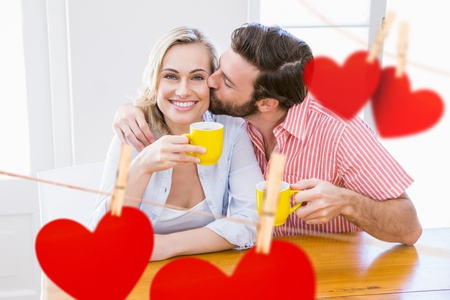 Composite image of red hearts and man kissing a womanの写真素材