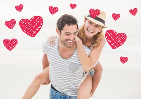 Composite of happy man giving piggy back to woman against white backgroundの写真素材