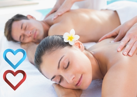 Composite image of couple receiving massage in spaの写真素材