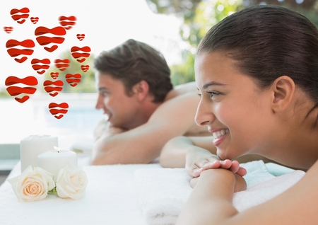 Composite image of couple relaxing together at spa center after a beauty treatmentの写真素材