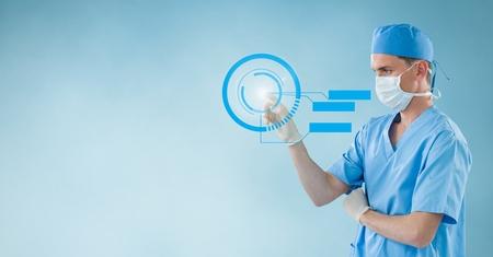 Doctor using blue interface screen against blue backgroundの写真素材