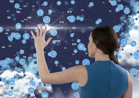 Mid section of businesswoman touching digitally generated connecting icons