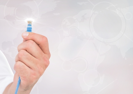 Happy businessman holding cable with flare against white backgroundの写真素材