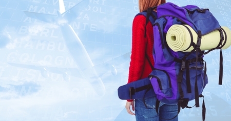 Mid section of woman with backpack against digitally generated background with plane taking off