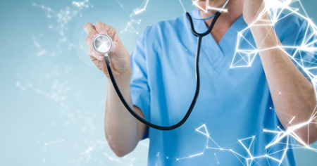Mid section of doctor examining with stethoscope against digitally generated interfaceの写真素材