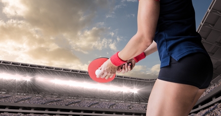 Digital composite of Table tennis player lower body against stadium and sky with cloudsの写真素材