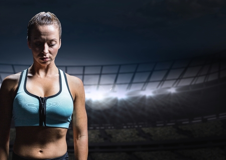 Digital composite of Sad disappointed woman athlete against staadium backgroundの写真素材