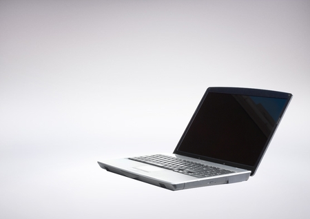 Digital composite of 3D Laptop against grey background