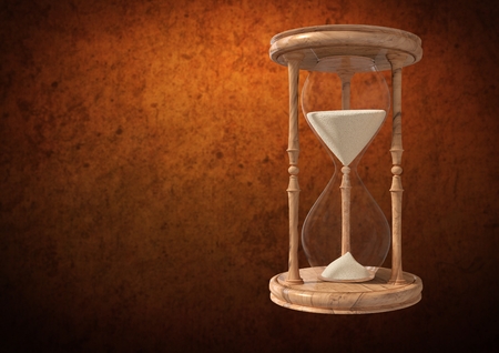 Digital composite of Egg Timer with sand against brown background