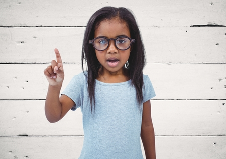Digital composite of Girl with glasses against white wood panelの写真素材