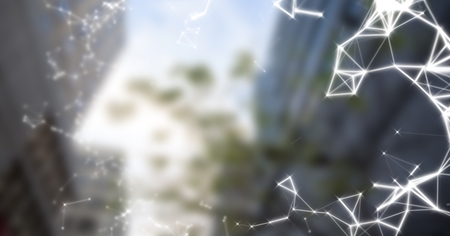 Digital composite of White interface against blurry buildings