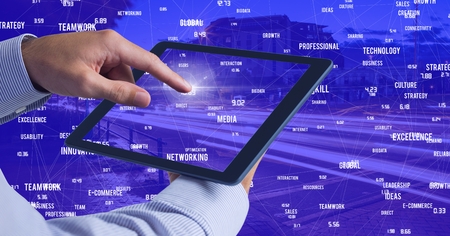 Digital composite of Hand touching tablet against Night city with connectors