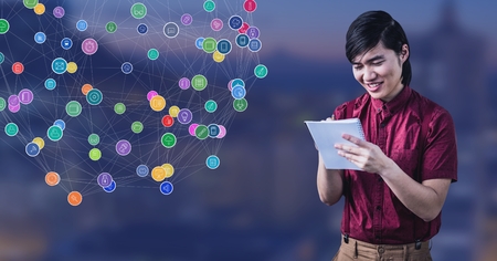 Digital composite of Man writing plans in notebook against Night city with connectors