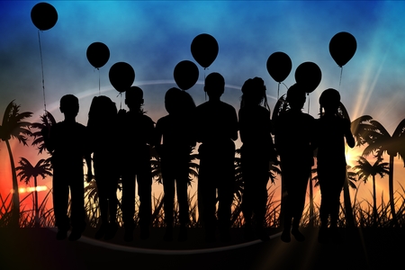 Digital composite of Silhouettes of  kids with balloons against sunset view with palm treesの写真素材