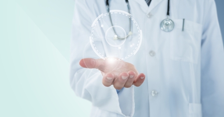 Digital composite of Doctor mid section with white interface and flare on hand against blue backgroundの写真素材
