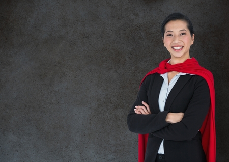 Digital composite of Business Superhero against stone wallの写真素材