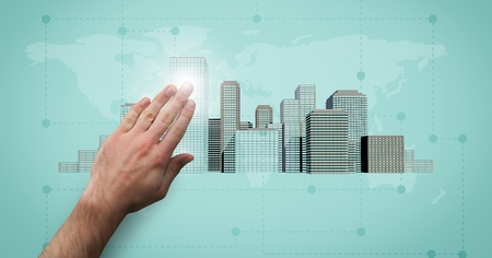 Digital composite of Hand touching pointing City with world mapの写真素材